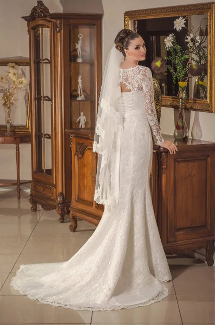 ---Very sensual and romantic wedding dress for winter wedding with semi-sheer long sleeves made entirely of lace with a draped s