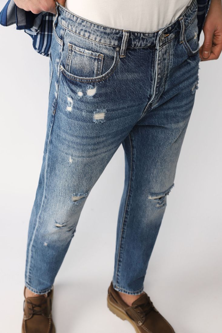 Jeans slim-fit con abrasioni ed effetto délavé